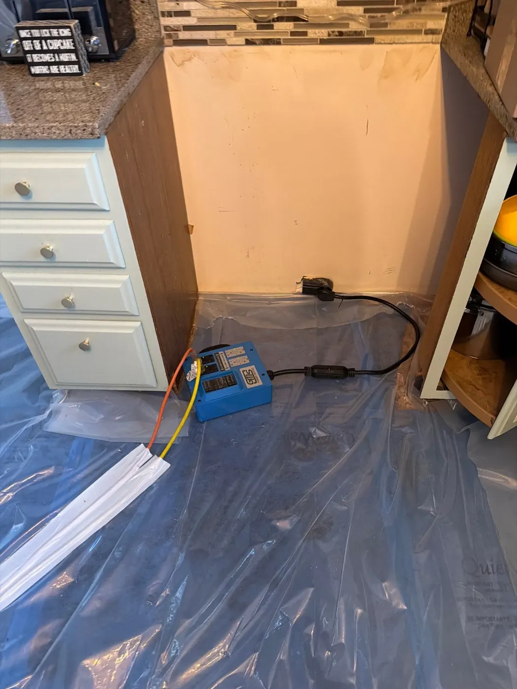 Moisture meter reading on drywall in Heron Hill water loss